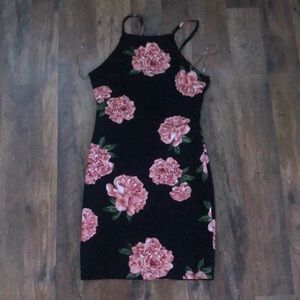 Beautiful form fitting to lower thigh dress.